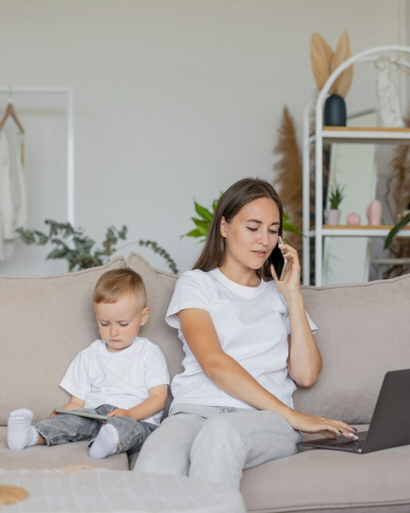 freelancer or remote worker woman works and raises young children